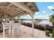 Covered outdoor patio area with waterfront views and comfortable seating available to residents at 315 Blackrock Ln, Apollo Beach, FL 33572