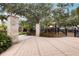 Playground entrance featuring stone pillars, iron gate, and a charming walkway leading to play area at 315 Blackrock Ln, Apollo Beach, FL 33572