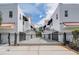 Exterior of a community of condos with black gates and beautiful sky at 3210 W Horatio St # 9, Tampa, FL 33609