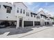 Contemporary townhomes feature black awnings, terra cotta roofs and attached garages at 3210 W Horatio St # 9, Tampa, FL 33609