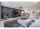 Open-concept living room boasts a modern panel wall, stylish seating, and views of the kitchen at 3210 W Horatio St # 9, Tampa, FL 33609