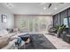 Inviting living room featuring a stylish panel wall, lots of space, and great natural light at 3210 W Horatio St # 9, Tampa, FL 33609