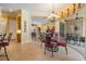 Charming dining room with elegant lighting and access to the outdoor patio at 33744 Americana Ave, Dade City, FL 33525