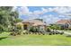 Charming single-Gathering home with beautiful landscaping, stone accents, and a tile roof at 33744 Americana Ave, Dade City, FL 33525