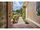 Inviting front entrance showcasing landscaped pathway and decorative door, creating a warm welcome at 33744 Americana Ave, Dade City, FL 33525