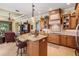 Gourmet kitchen with granite countertops, island seating, custom cabinets and open floor plan at 33744 Americana Ave, Dade City, FL 33525