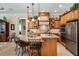 Gourmet kitchen with granite countertops, stainless steel appliances, and custom cabinetry at 33744 Americana Ave, Dade City, FL 33525