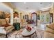 Elegant living room featuring neutral decor, with an inviting layout, that connects to the dining area and kitchen at 33744 Americana Ave, Dade City, FL 33525
