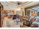 Bright and open living room connected to the kitchen, with a view of the lanai and backyard at 33744 Americana Ave, Dade City, FL 33525