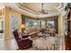 Cozy living room boasts comfortable seating, natural light, and backyard views, offering a relaxing space at 33744 Americana Ave, Dade City, FL 33525