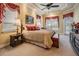 Relaxing bedroom retreat with a canopy-style bed, dresser, and bright windows at 33744 Americana Ave, Dade City, FL 33525