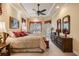 Serene main bedroom showcases trey ceiling, large bed, and plenty of natural light, creating a relaxing retreat at 33744 Americana Ave, Dade City, FL 33525