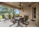 Relaxing screened-in patio with outdoor dining set, perfect for enjoying the backyard view at 33744 Americana Ave, Dade City, FL 33525