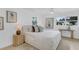 Bright bedroom featuring a neutral palette, stylish furnishings, and plenty of natural light from two large windows at 3381 19Th Sw Pl, Largo, FL 33774
