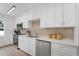 Updated kitchen featuring stainless steel appliances and stylish backsplash at 3381 19Th Sw Pl, Largo, FL 33774