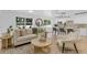 The open-concept living space has great natural light and easy access to the kitchen at 3381 19Th Sw Pl, Largo, FL 33774