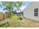 Home featuring a screened pool and landscaped yard at 3502 King Richard Ct, Seffner, FL 33584