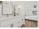 Bright bathroom with double vanity, modern fixtures, and view into the spacious bedroom at 3502 King Richard Ct, Seffner, FL 33584