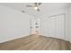 Bright bedroom features wood-look floors and a closet for ample storage at 3502 King Richard Ct, Seffner, FL 33584
