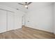 Bedroom featuring wood-look floors and closet at 3502 King Richard Ct, Seffner, FL 33584