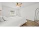 Bright bedroom with light wood-look floors, a ceiling fan, and lots of natural light at 3502 King Richard Ct, Seffner, FL 33584