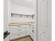 Walk-in closet with custom shelving, wood countertops, cabinets, and drawers, providing ample storage space at 3502 King Richard Ct, Seffner, FL 33584