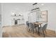 Dining room with modern light fixture, gray upholstered chairs, and a dry bar with beverage cooler at 3502 King Richard Ct, Seffner, FL 33584