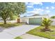 Charming single-story home featuring a well-manicured lawn and attached two-car garage at 3502 King Richard Ct, Seffner, FL 33584