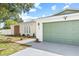 Close up of front exterior of a single story home with a 2 car garage and decorative front yard at 3502 King Richard Ct, Seffner, FL 33584