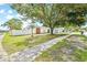 Charming single-story home nestled among mature trees, featuring a spacious lawn at 3502 King Richard Ct, Seffner, FL 33584
