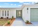 Close up of front door of a single story home with decorative front yard at 3502 King Richard Ct, Seffner, FL 33584