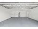Spacious garage with epoxy flooring and utility fixtures at 3502 King Richard Ct, Seffner, FL 33584