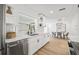 Modern kitchen sink, stainless steel appliances, and adjacent dining area at 3502 King Richard Ct, Seffner, FL 33584