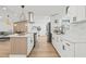 Bright kitchen with modern stainless steel appliances, island with seating, and plenty of cabinet space at 3502 King Richard Ct, Seffner, FL 33584