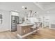 Kitchen island with stainless steel appliances, and pendant lighting at 3502 King Richard Ct, Seffner, FL 33584