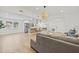 Open-concept floor plan with seamless flow from living area to modern kitchen at 3502 King Richard Ct, Seffner, FL 33584