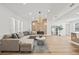 Spacious living room boasts stylish decor, including a chic sectional and modern fireplace at 3502 King Richard Ct, Seffner, FL 33584