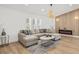 Comfortable living room with a large sectional couch and modern fireplace at 3502 King Richard Ct, Seffner, FL 33584