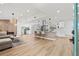 Bright, airy open-concept living space flowing into modern kitchen with pendant lighting at 3502 King Richard Ct, Seffner, FL 33584
