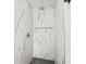 The tiled shower features elegant marble and a rainfall showerhead at 3502 King Richard Ct, Seffner, FL 33584