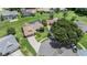 Aerial view of a single-Gathering home with a screened-in pool and well-maintained landscaping at 37147 Foxrun Pl, Zephyrhills, FL 33542