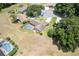 Inviting home boasts a refreshing private pool, complemented by mature trees and landscaping, creating a tranquil retreat at 37147 Foxrun Pl, Zephyrhills, FL 33542