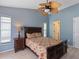 Cozy bedroom featuring a bed and beautiful furnishings, creating an inviting space to rest at 37147 Foxrun Pl, Zephyrhills, FL 33542