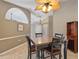 Inviting dining area featuring a stylish ceiling fan and seamless entry into the home at 37147 Foxrun Pl, Zephyrhills, FL 33542