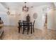 Dining area featuring tile flooring and modern light fixtures at 37147 Foxrun Pl, Zephyrhills, FL 33542