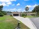 Charming single-story home with a well-manicured lawn and screened garage at 37147 Foxrun Pl, Zephyrhills, FL 33542