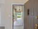 Welcoming front entryway offering a glimpse of the exterior with an arched feature and screened entry at 37147 Foxrun Pl, Zephyrhills, FL 33542