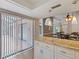 Eat-in kitchen with granite countertops and stylish cabinets, creating an inviting space to dine and cook at 37147 Foxrun Pl, Zephyrhills, FL 33542