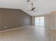 Spacious living room featuring vinyl flooring, modern paint colors, and lots of natural light at 37147 Foxrun Pl, Zephyrhills, FL 33542
