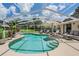 Relaxing pool area with lounge chairs and tropical plants, ideal for enjoying the Florida sunshine at 37147 Foxrun Pl, Zephyrhills, FL 33542